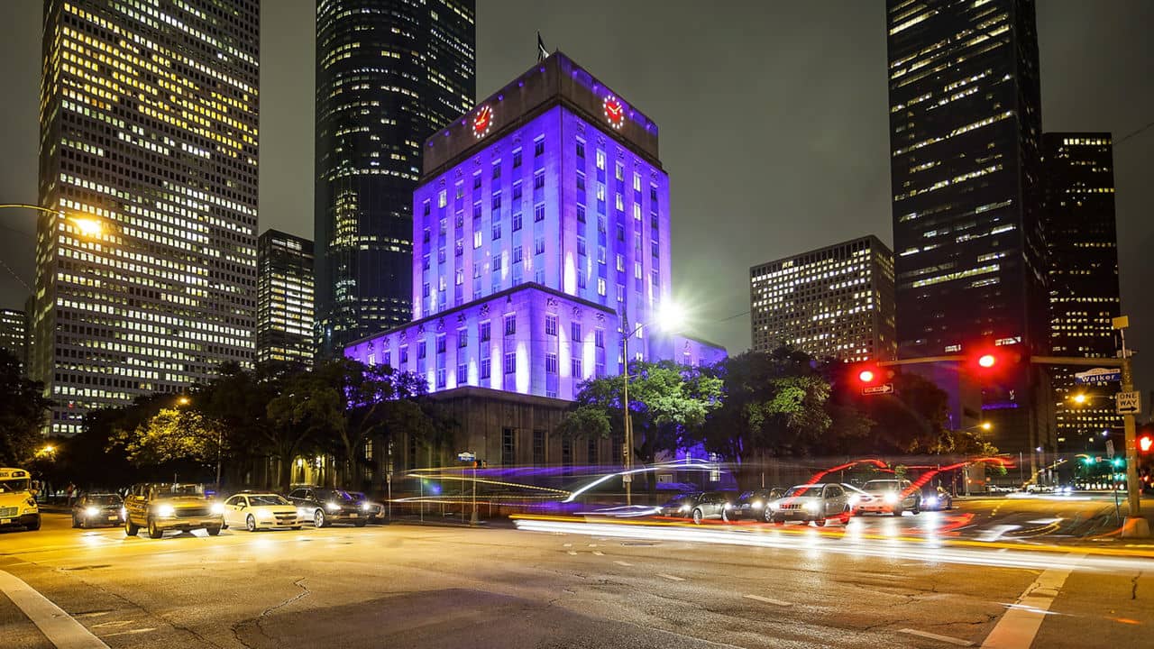 Houston City Hall building and traffic at night in downtown Houston, Texas