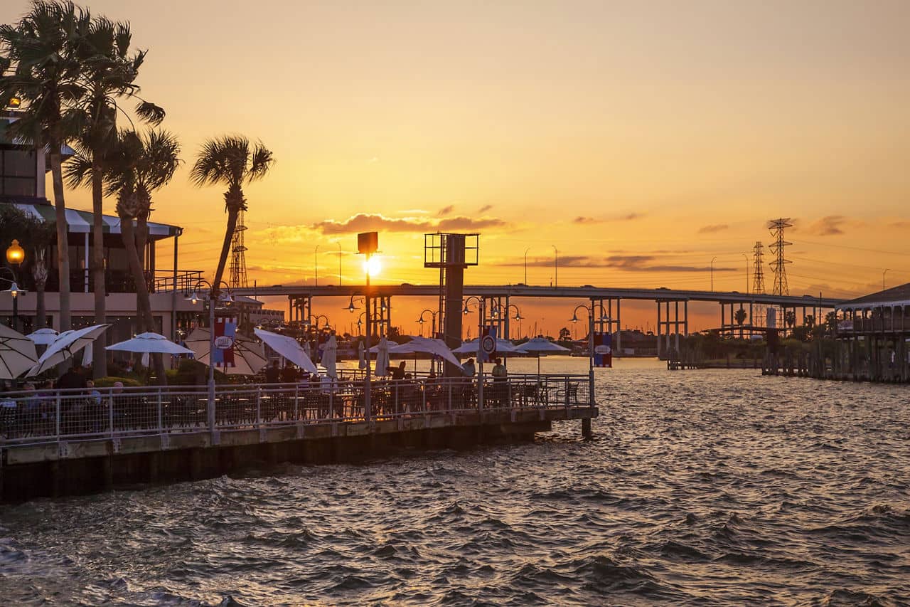 KEMAH, TX, USA - APR 14, 2016: Sunset at the Kemah Boardwalk. Kemah is a famous resort in the Galveston Bay area. Texas, United States